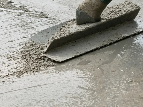 Freshly placed 3000 PSI Fiber-Reinforced concrete surface being finished
